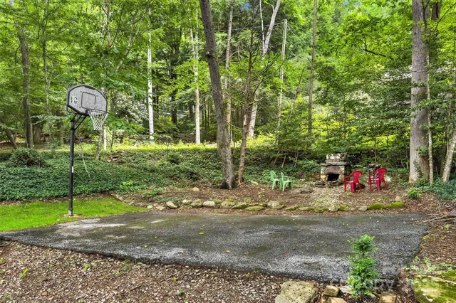 a front view of a house with a yard and potted plants