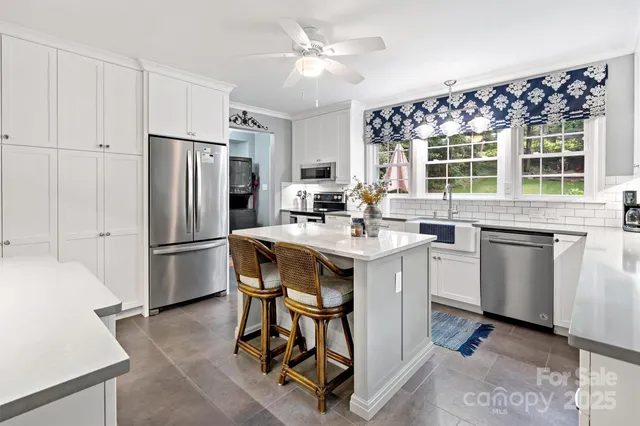 a kitchen with a stove and a microwave