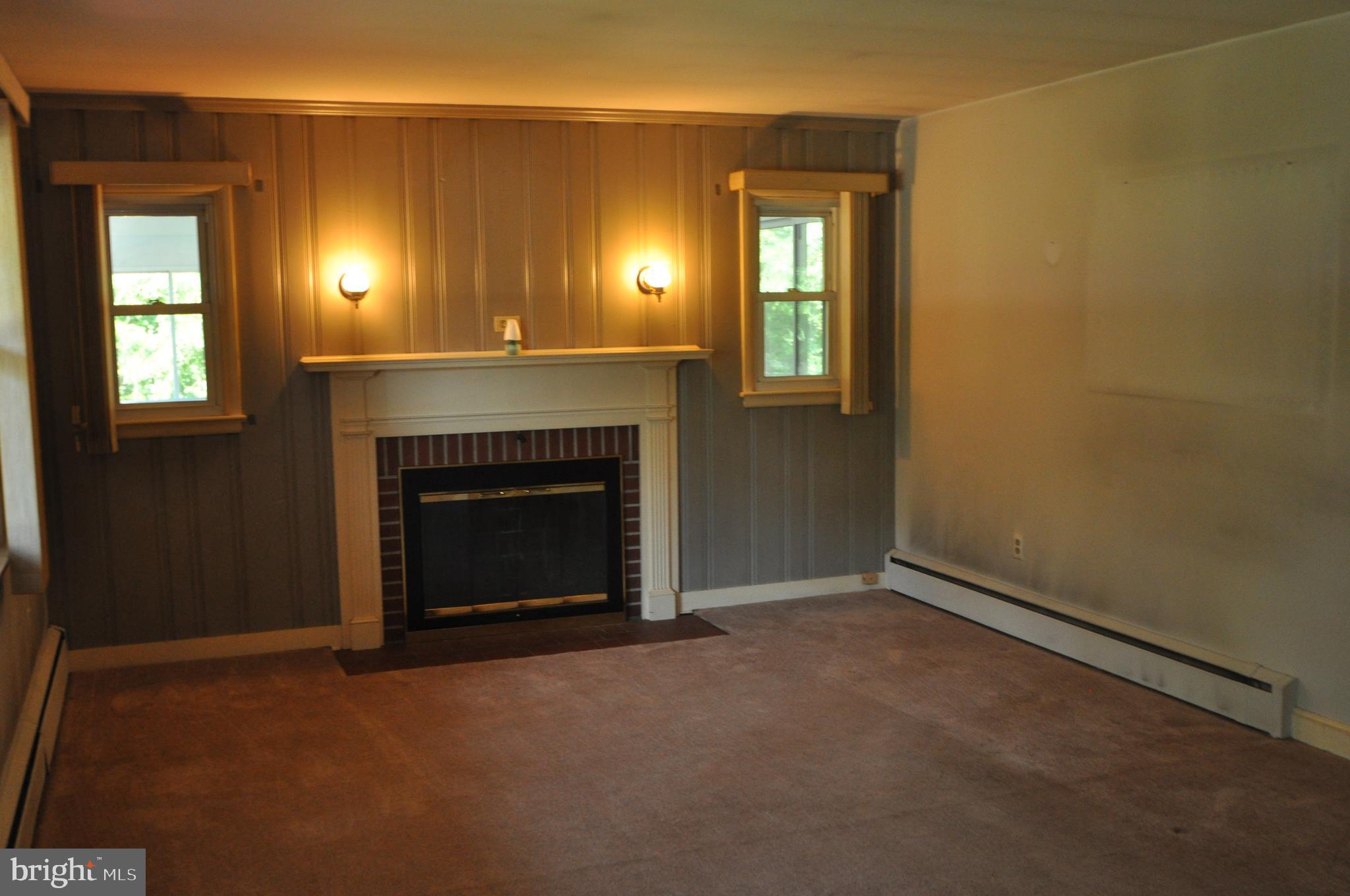 1431 Ridge Road Westminster, MD 21157 - Photo 3 of 23 Wood burning fireplacein living room