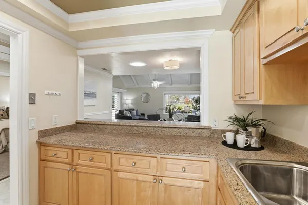 a spacious bedroom with a bed and a cabinets