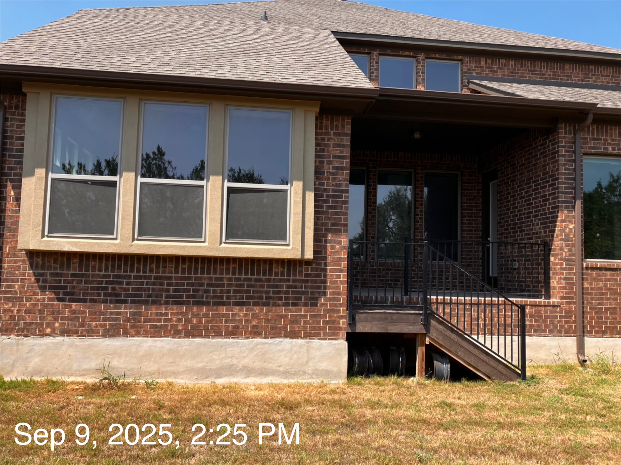 1104 Round Mountain Pass Georgetown, TX 78628 - Photo 11 of 12 a view of a house with a balcony