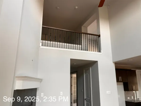 a room with wooden floor and a window
