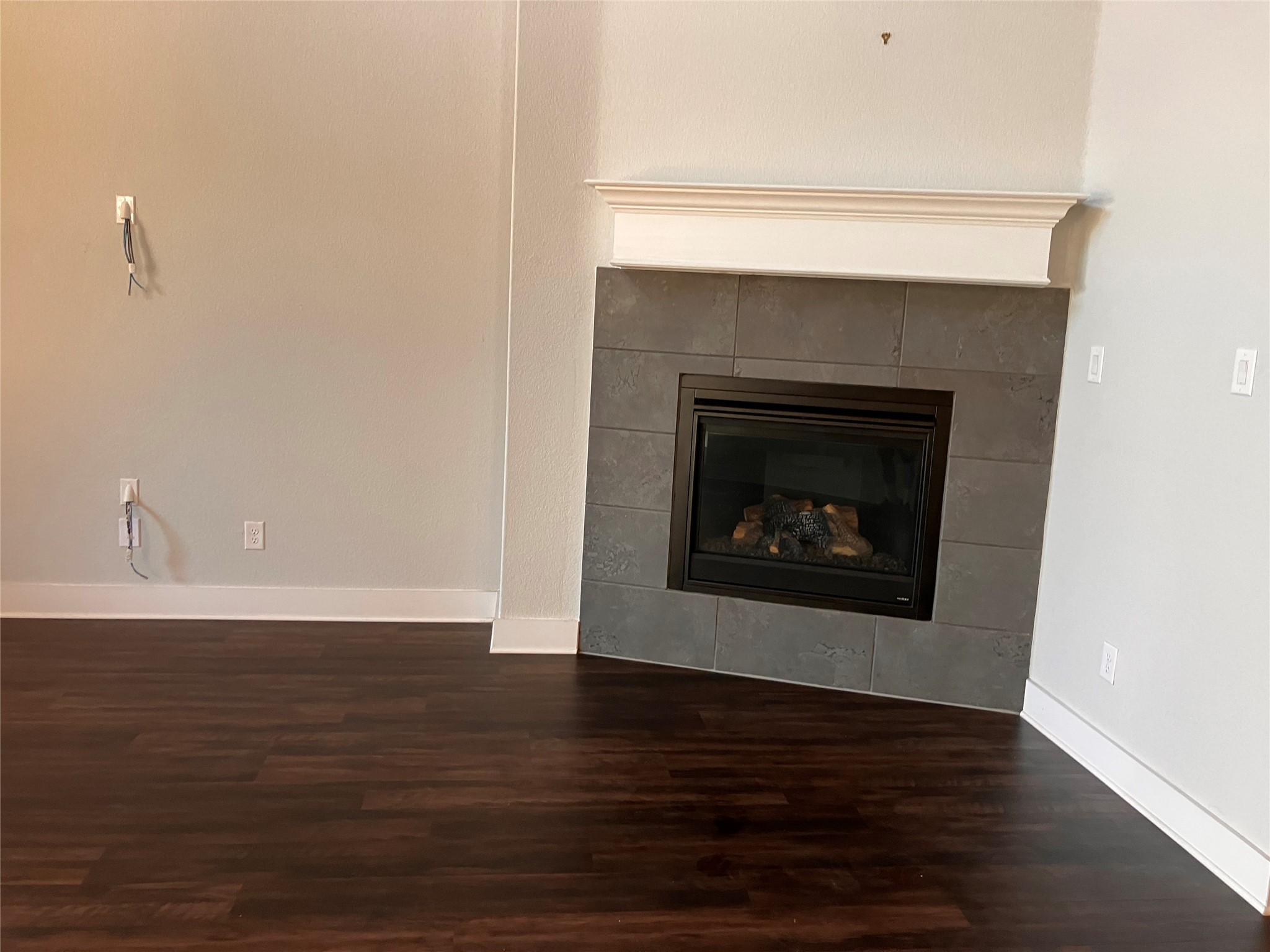 1104 Round Mountain Pass Georgetown, TX 78628 - Photo 8 of 12 a room with a fireplace and a fireplace
