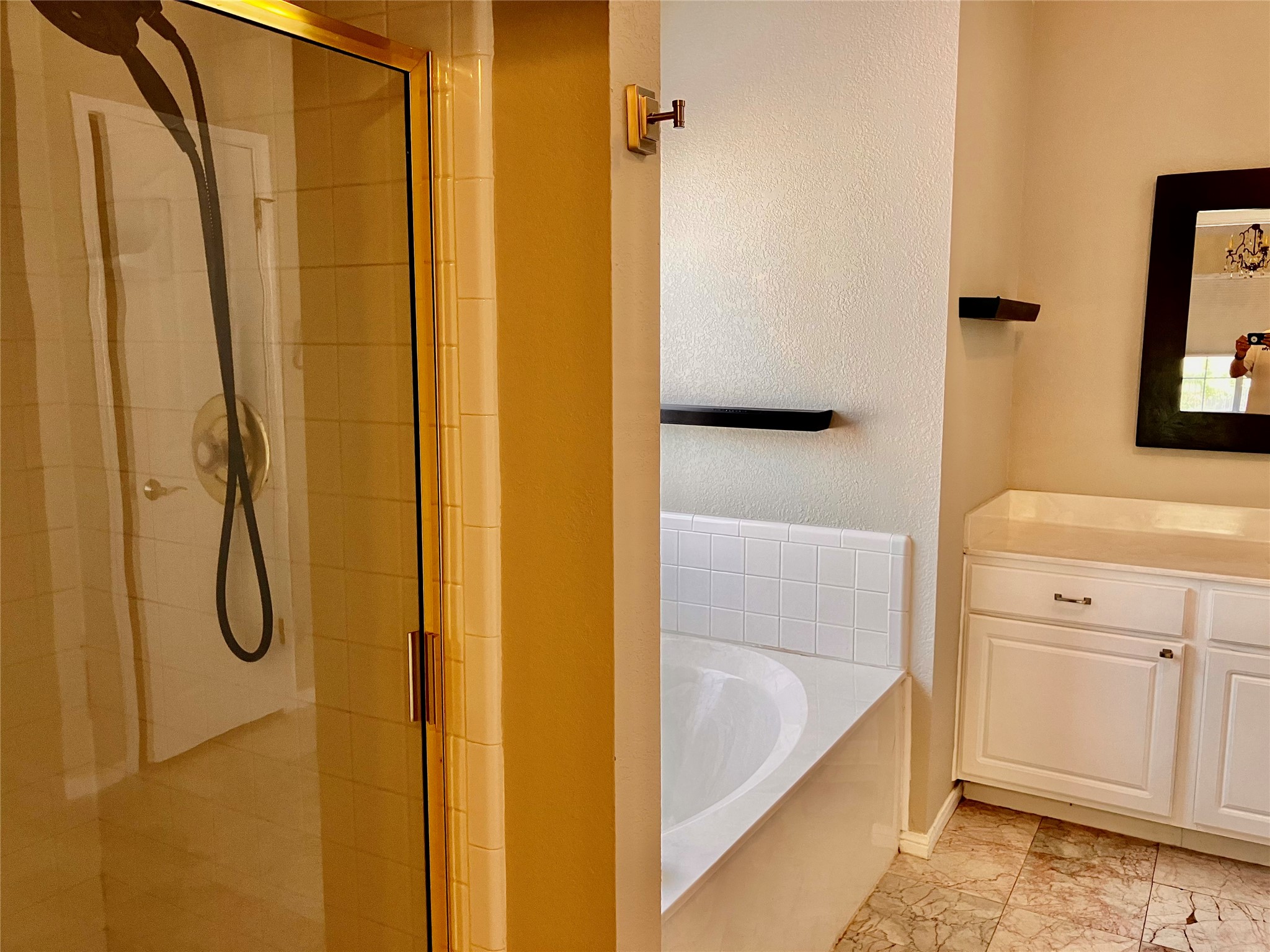 1104 Round Mountain Pass Georgetown, TX 78628 - Photo 9 of 12 a bathroom with a tub a sink and a shower