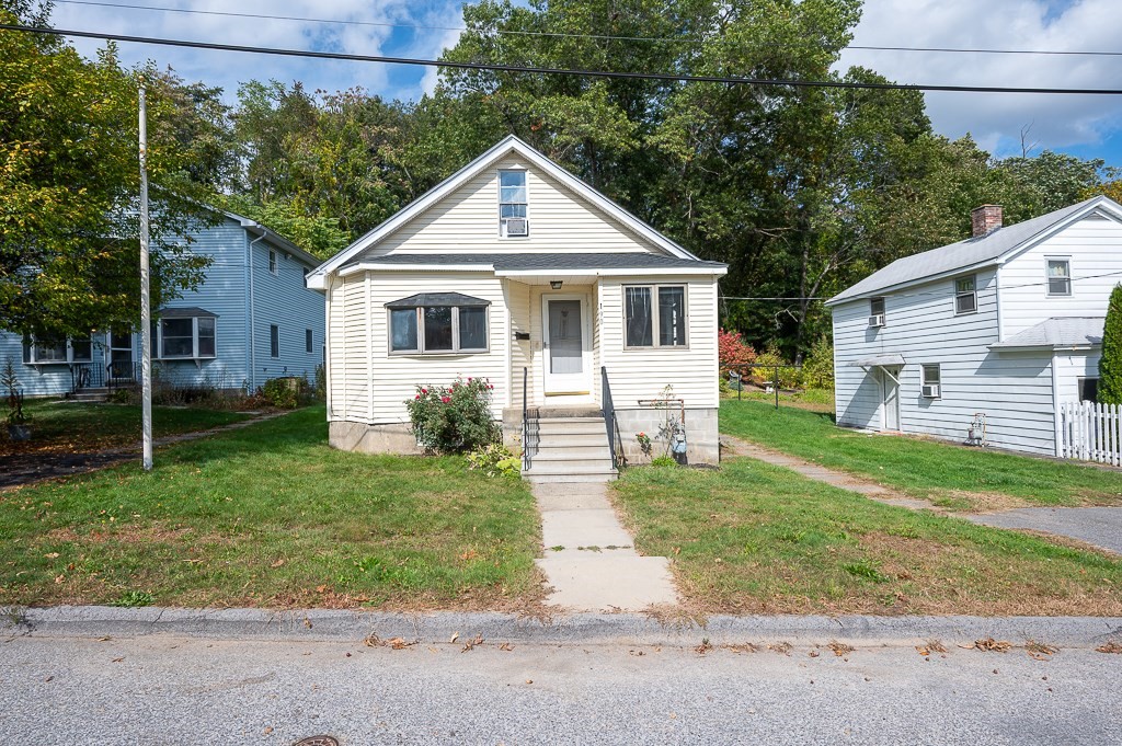 a front view of a house with a yard