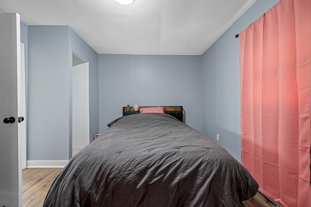 190 Dominion Road Worcester, MA 01605 - Photo 13 of 21 a bedroom with a bed and curtain