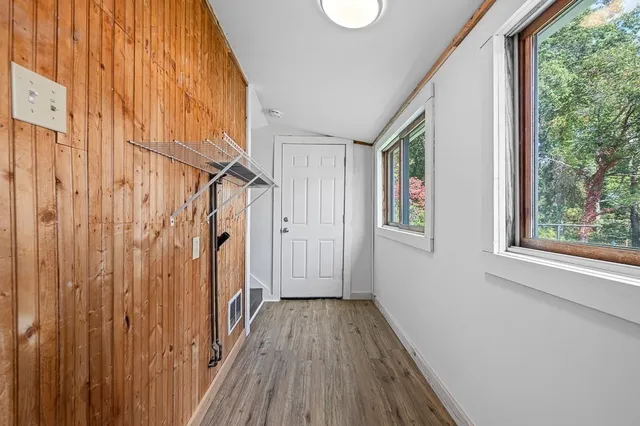 a view of a house with wooden floor and stairs