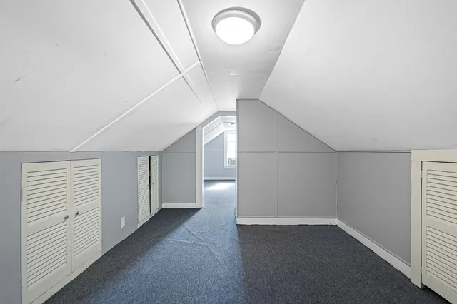 a view of a big room with closet and windows