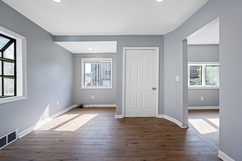190 Dominion Road Worcester, MA 01605 - Photo 4 of 21 a view of an empty room with wooden floor and a window
