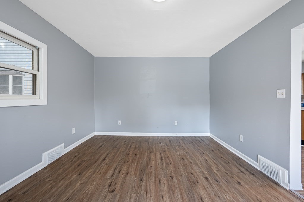 190 Dominion Road Worcester, MA 01605 - Photo 5 of 21 a view of a room with wooden floors and led lights