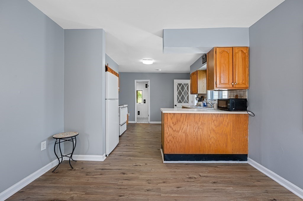 190 Dominion Road Worcester, MA 01605 - Photo 7 of 21 a view of kitchen with furniture and wooden floor