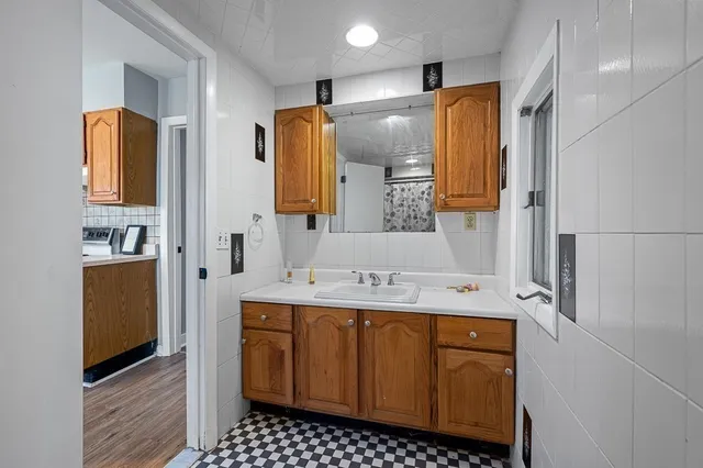 a bathroom with a sink and a mirror