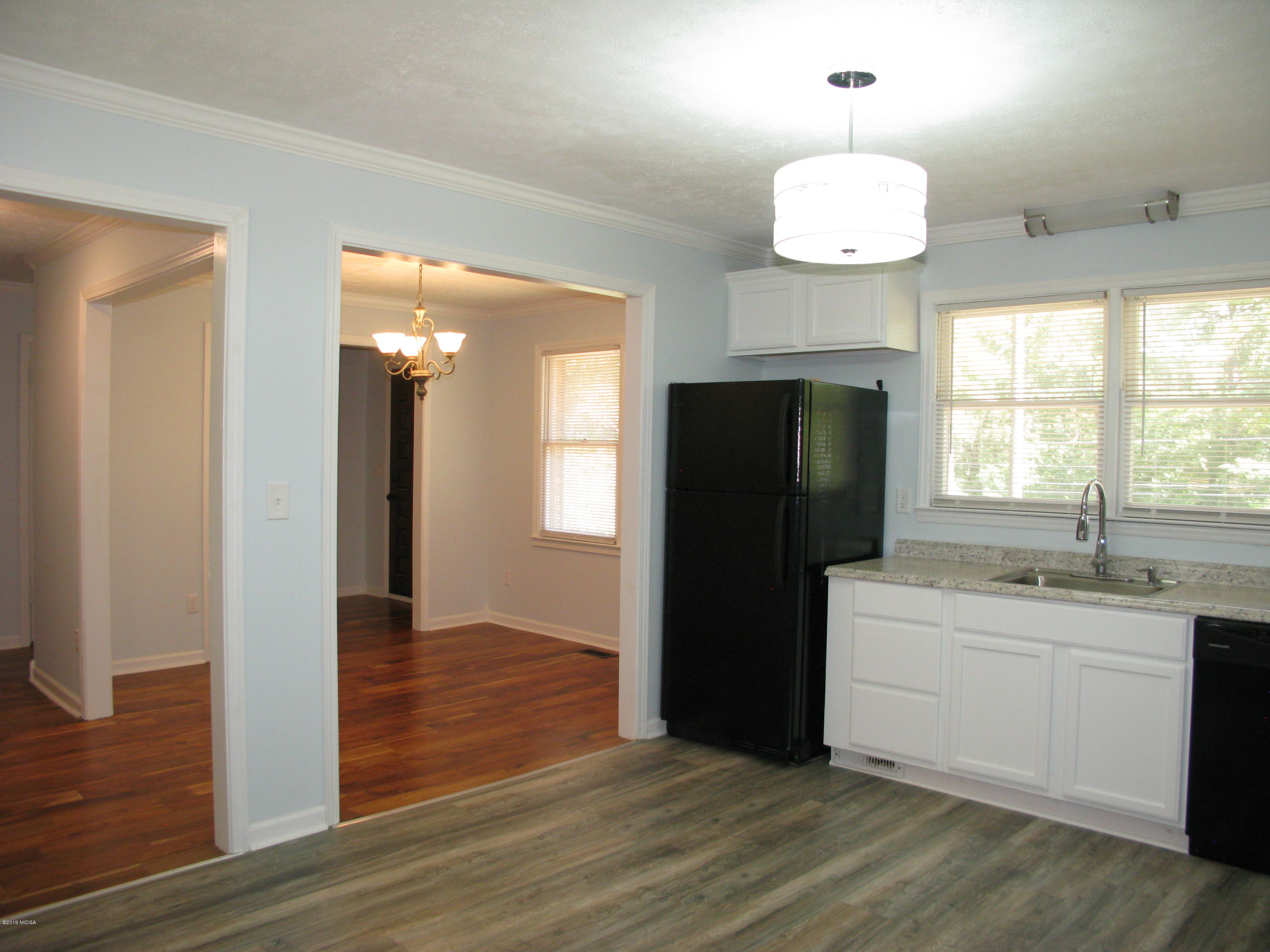 3812 Western Way Macon, GA 31216 - Photo 11 of 29 a kitchen with a refrigerator and a sink