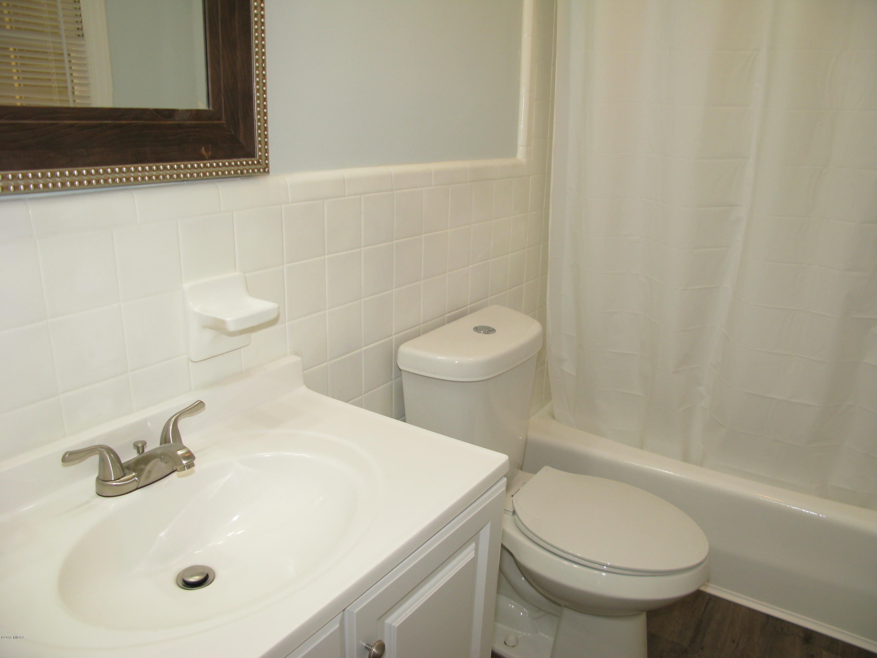 3812 Western Way Macon, GA 31216 - Photo 20 of 29 a bathroom with a sink a toilet and shower
