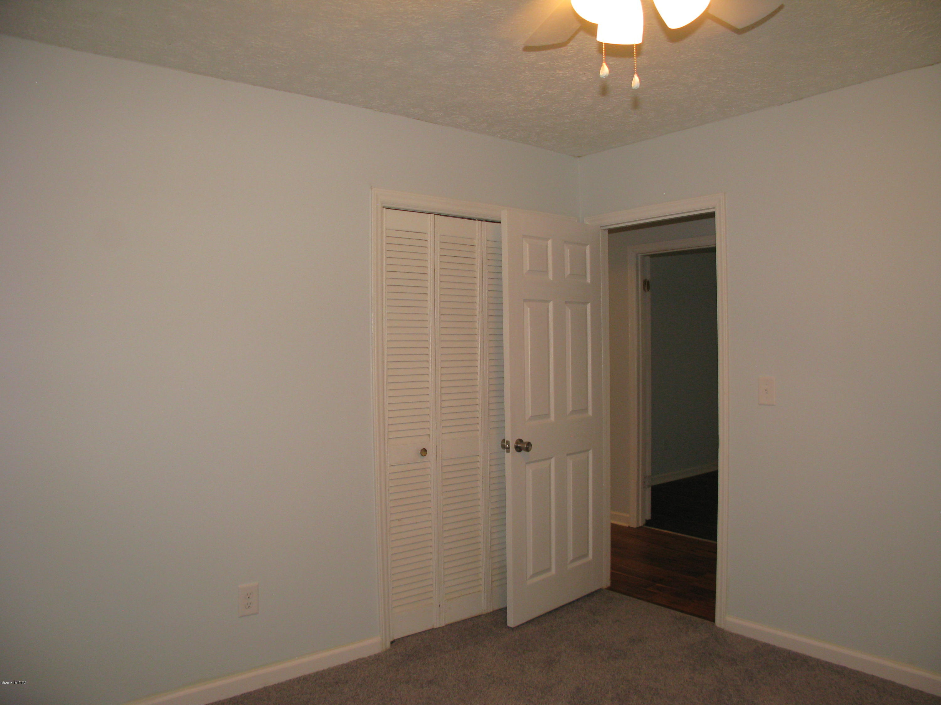 3812 Western Way Macon, GA 31216 - Photo 22 of 29 an empty room with a hallway