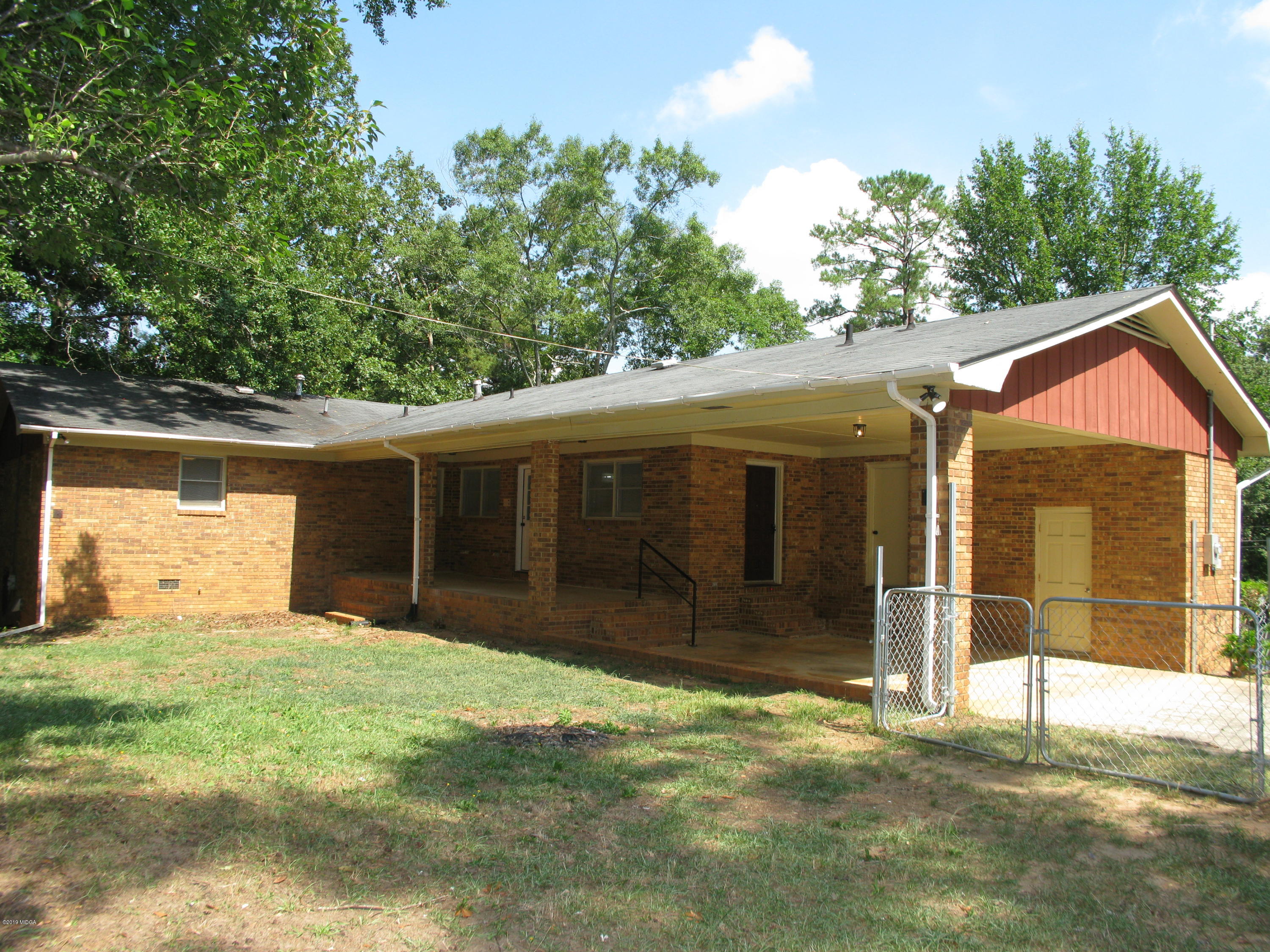 3812 Western Way Macon, GA 31216 - Photo 5 of 29 a view of a house with a yard and garage