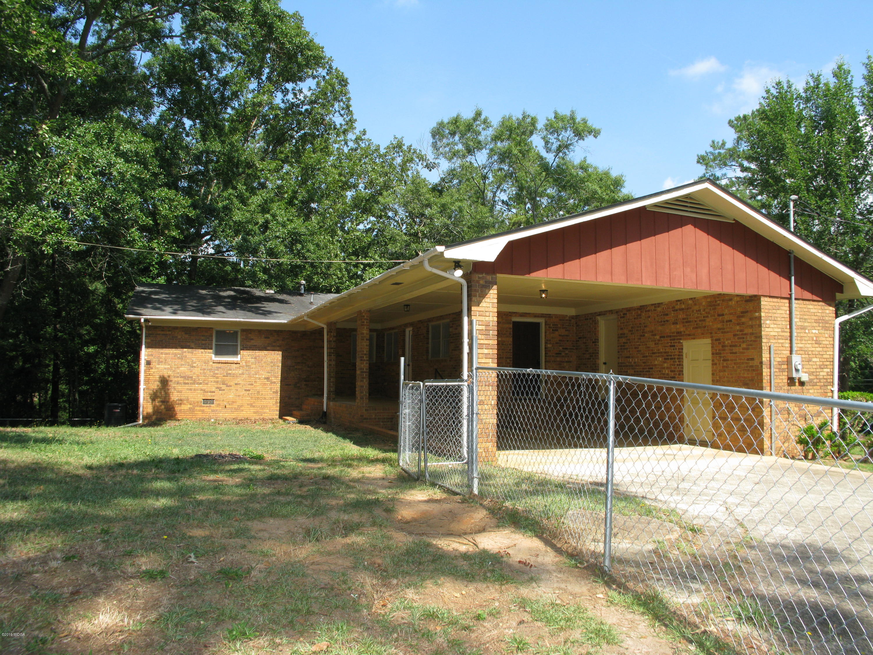 3812 Western Way Macon, GA 31216 - Photo 7 of 29 a view of a house with a yard and garage