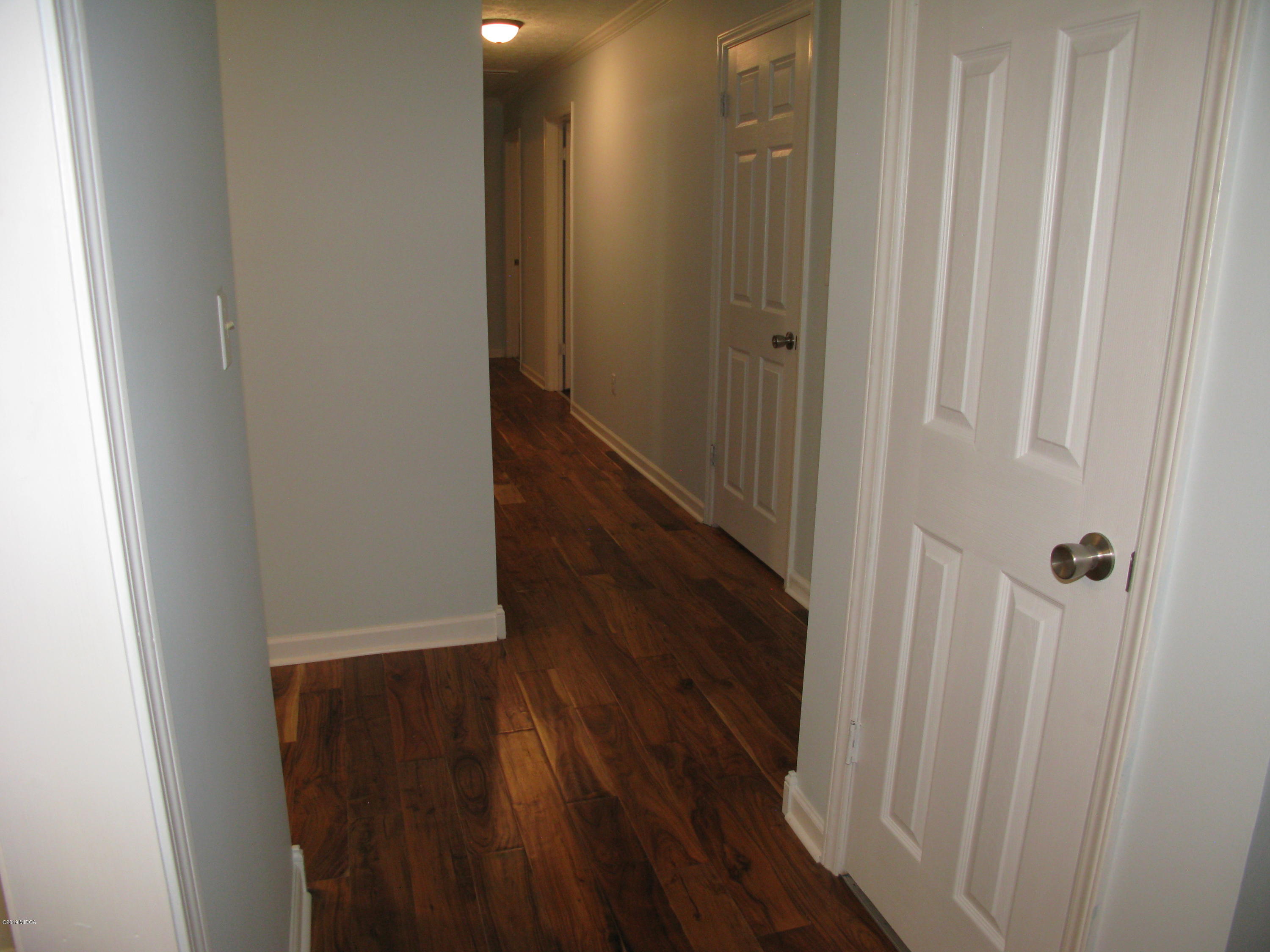 3812 Western Way Macon, GA 31216 - Photo 8 of 29 a view of a hallway with wooden floor