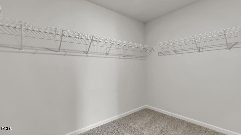 1248 Pavo Path Wendell, NC 27591 - Photo 25 of 46 a view of a room with racks on the wall