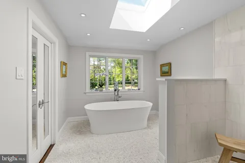 a bathroom with a bathtub and a sink