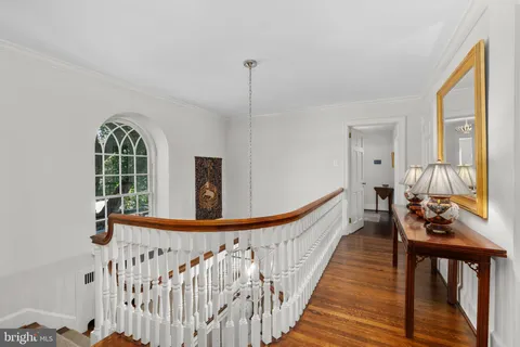 a view of a porch with wooden floor and windows