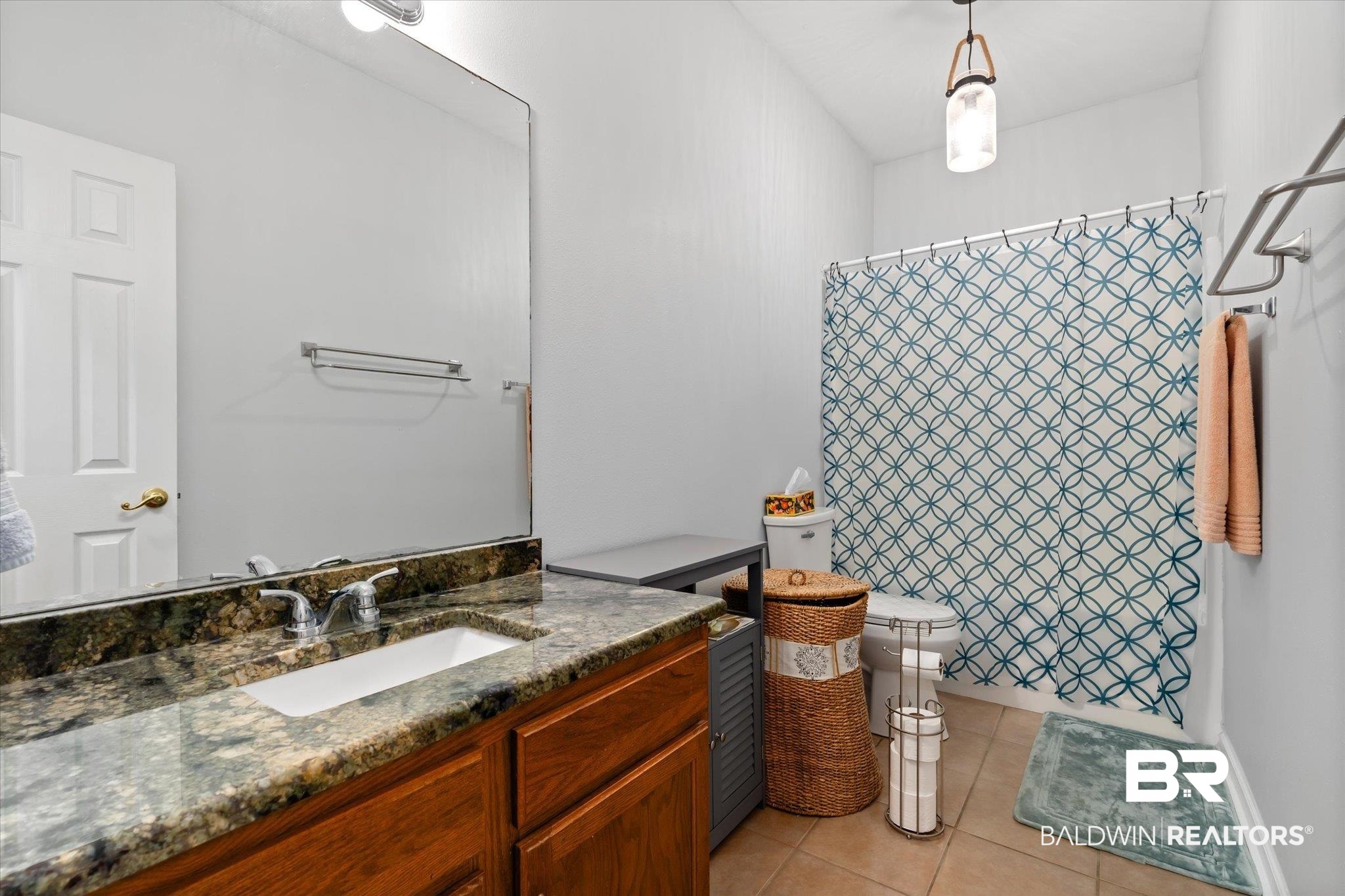 3876 Emerille Drive Foley, AL 36535 - Photo 20 of 31 Bathroom with toilet, a shower with curtain, vanity, and tile patterned flooring