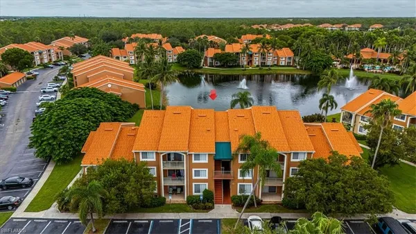 an aerial view of a house with a lake view