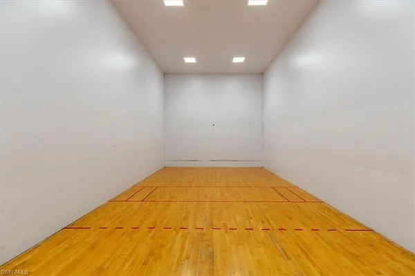 an aerial view of residential houses with outdoor space and lake view