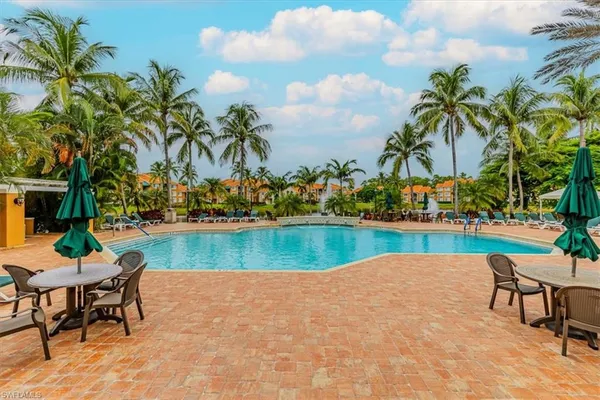 a front view of a brick house with a yard