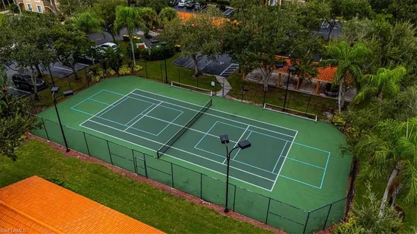 a view of swimming pool with outdoor seating and lake view