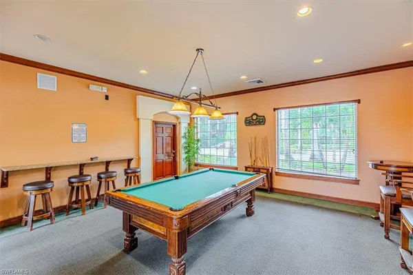 a view of a house with swimming pool and a yard