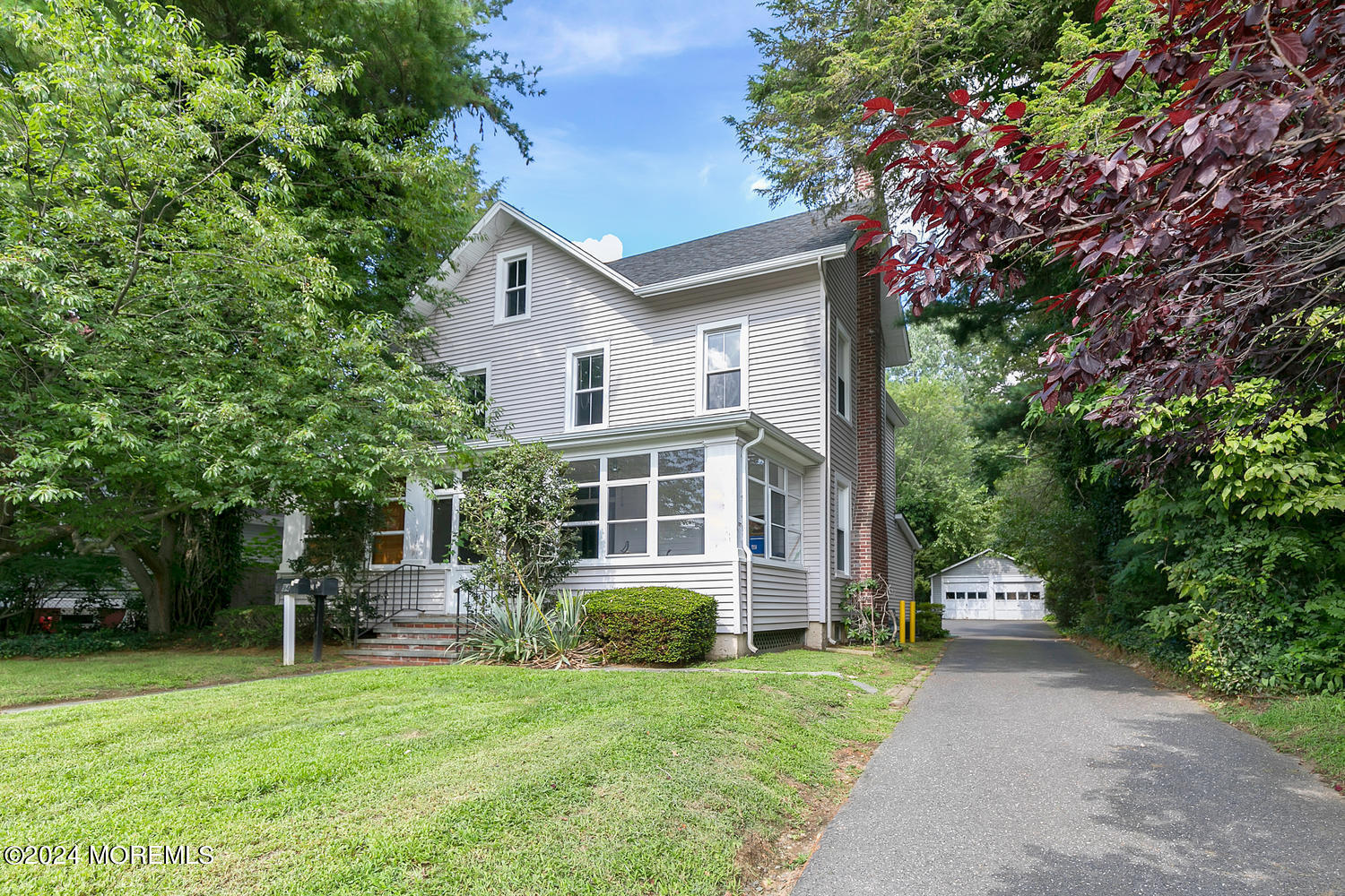 94 Branch Avenue Red Bank, NJ 07701 - Photo 1 of 21 a front view of a house with a garden