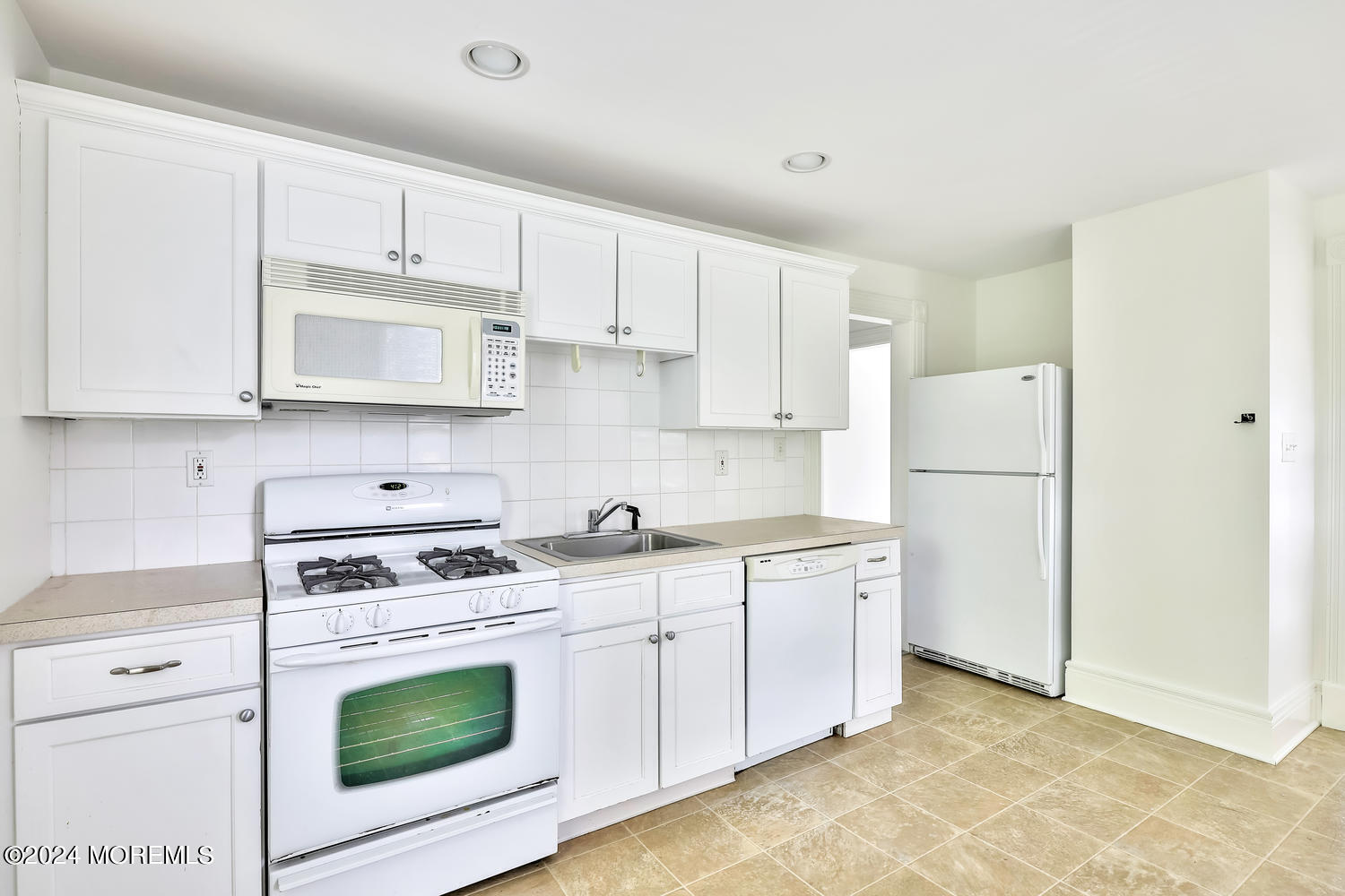 94 Branch Avenue Red Bank, NJ 07701 - Photo 12 of 21 a kitchen with cabinets appliances a sink and a counter space