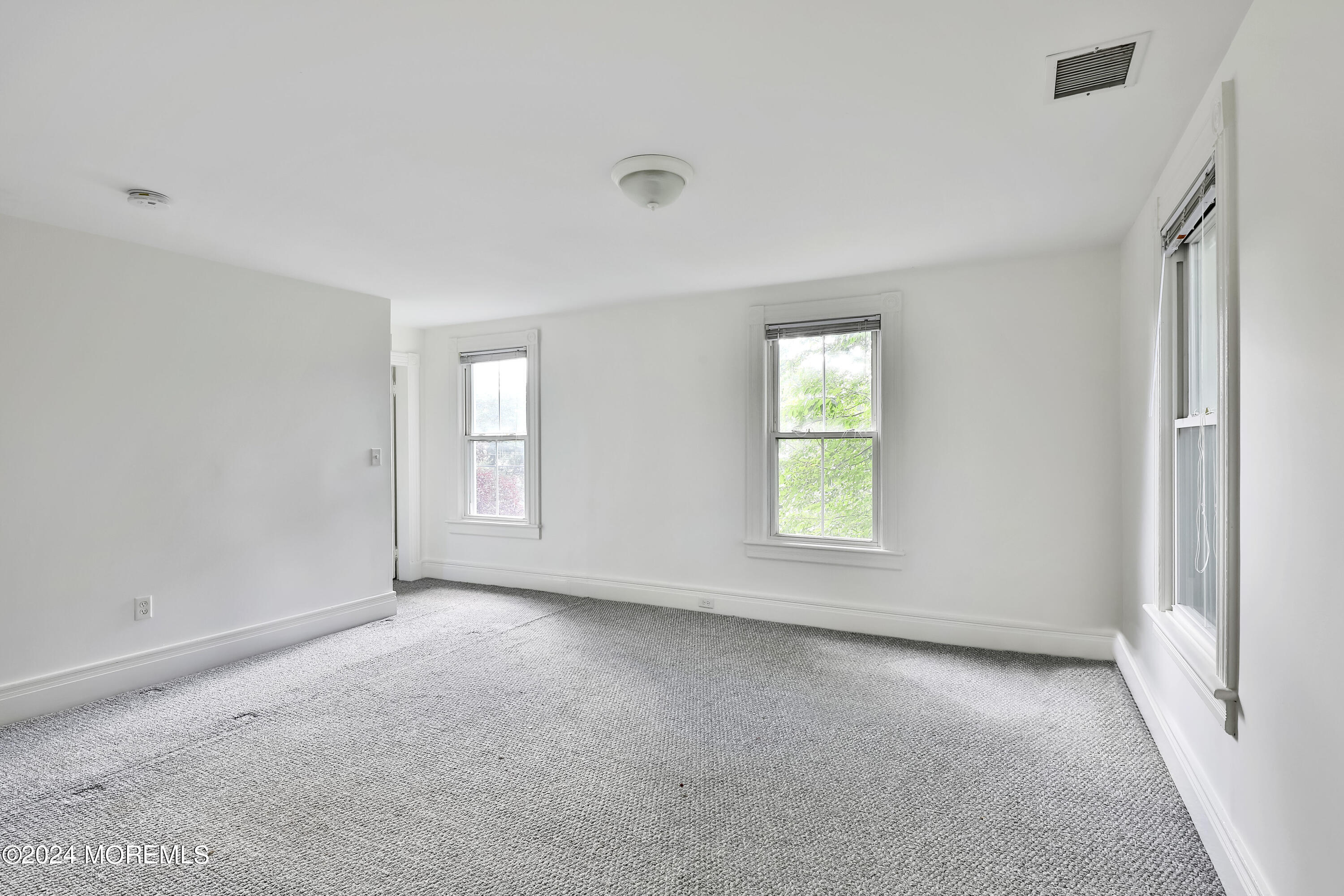 94 Branch Avenue Red Bank, NJ 07701 - Photo 16 of 21 a view of an empty room with a window