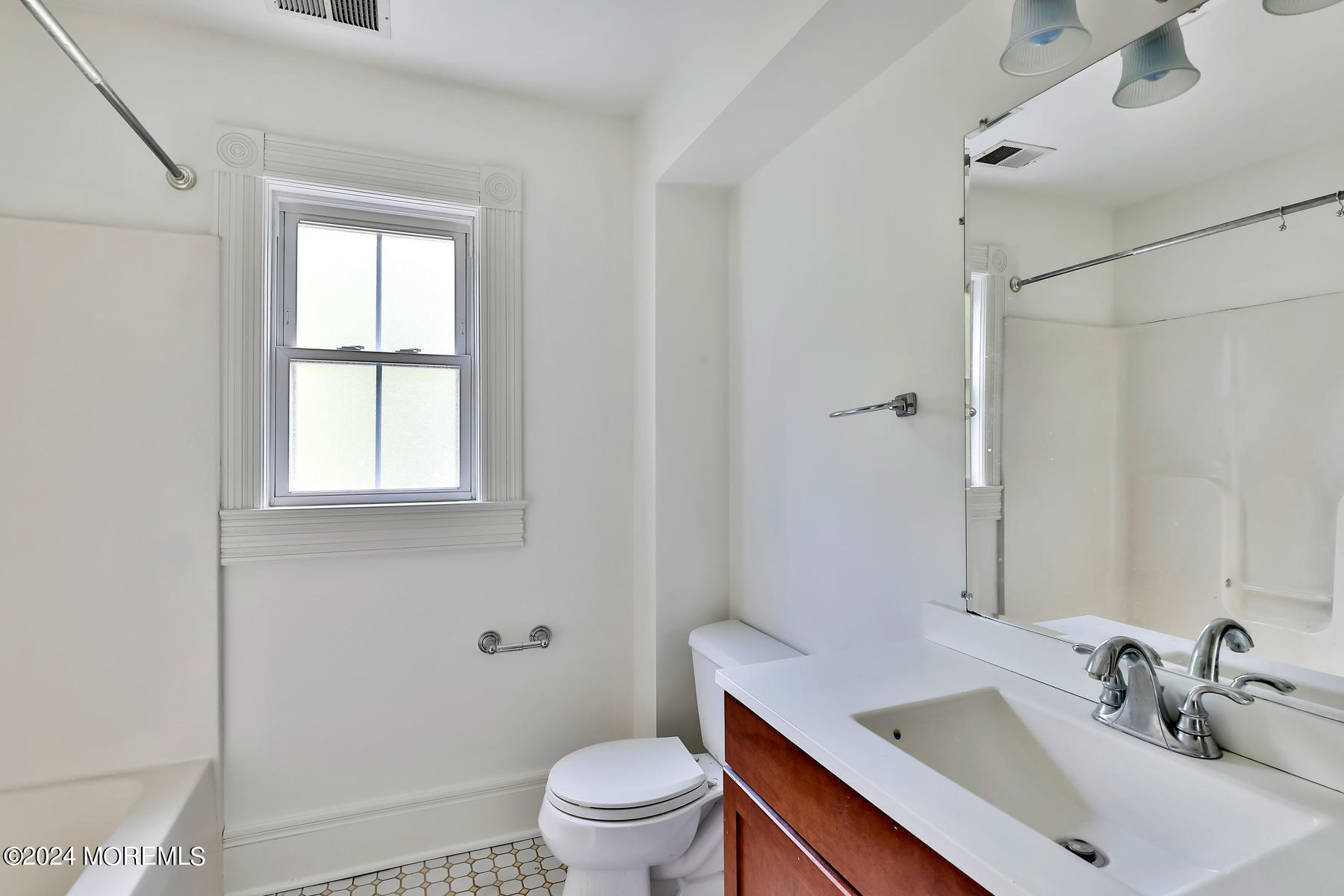 94 Branch Avenue Red Bank, NJ 07701 - Photo 17 of 21 a bathroom with a sink toilet and shower
