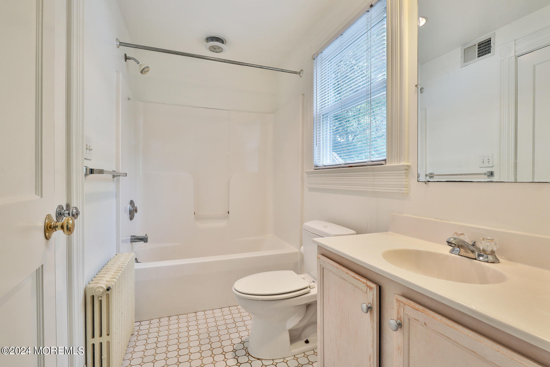 94 Branch Avenue Red Bank, NJ 07701 - Photo 9 of 21 a bathroom with a sink toilet and shower