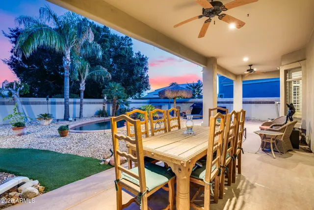 a view of a swimming pool with an outdoor seating