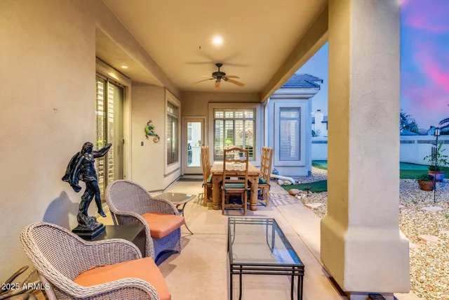 a view of a swimming pool with a patio and a yard