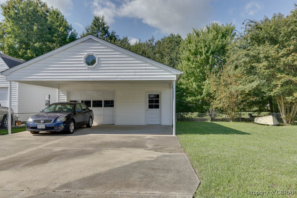 3204 West Weaver Road Hampton, VA 23666 - Photo 23 of 27 Garage featuring a lawn