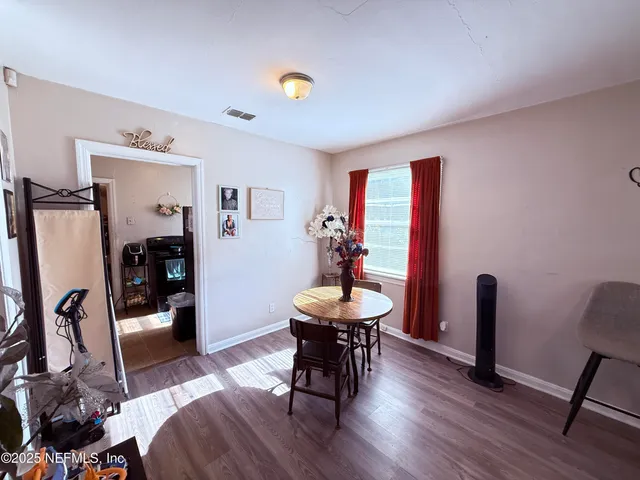 a view of a room with furniture and a window