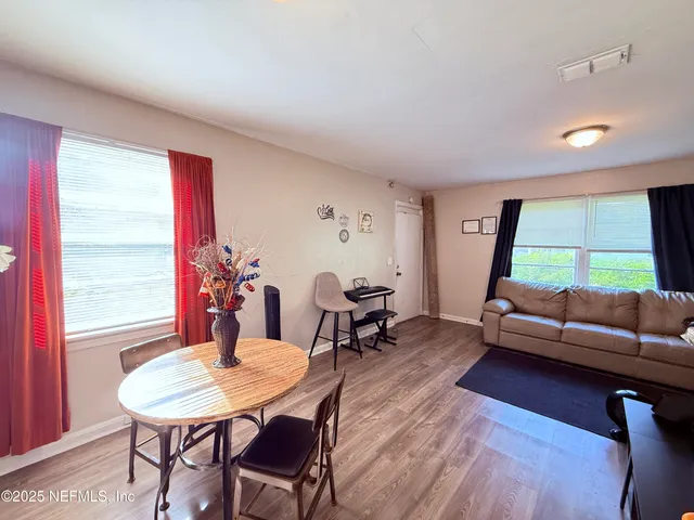 a living room with furniture and a window