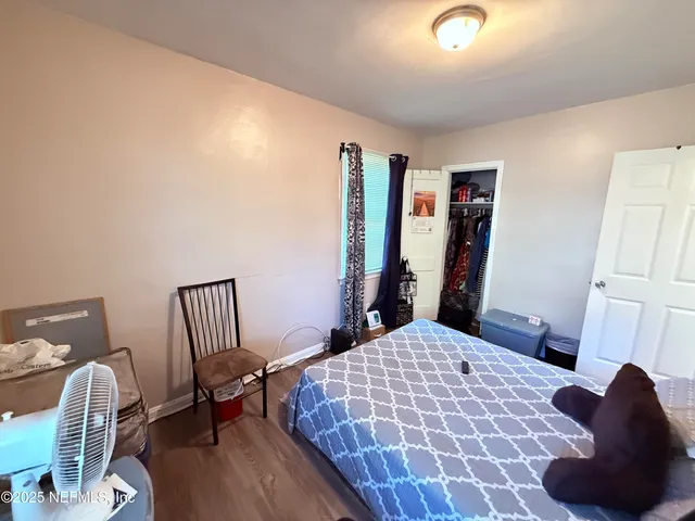 a bathroom with a bathtub shower sink vanity and toilet