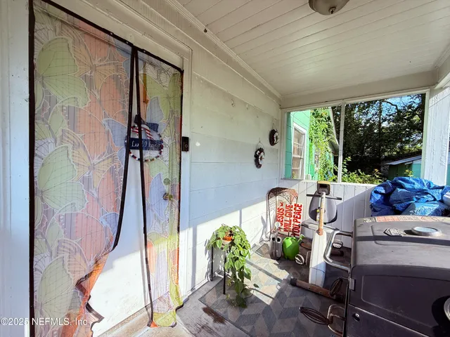 a view of a balcony with chairs