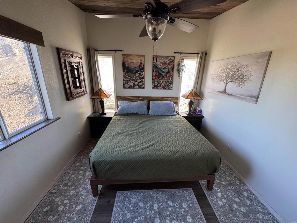 2494 Donnil Lane Fallbrook, CA 92028 - Photo 15 of 62 a bed sitting in a bedroom next to a window