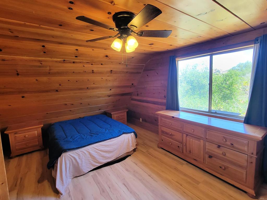 2494 Donnil Lane Fallbrook, CA 92028 - Photo 10 of 62 a view of a room with wooden floor and staircase