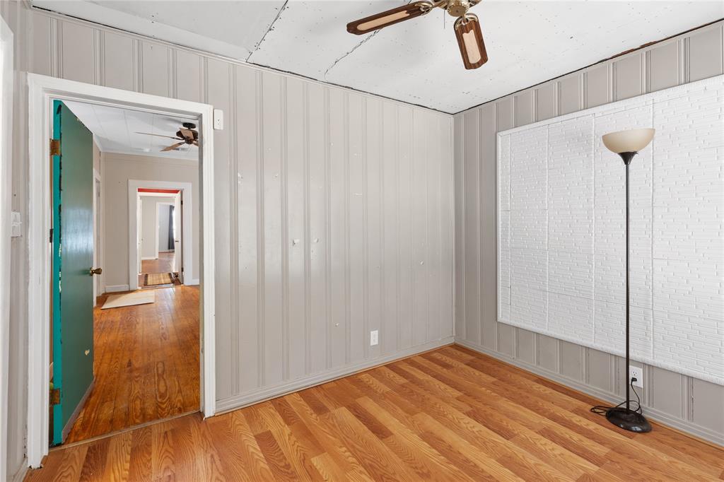 1005 Jernigan Street Commerce, TX 75428 - Photo 26 of 40 Another view of the office space looking through to adjoining bedroom.
