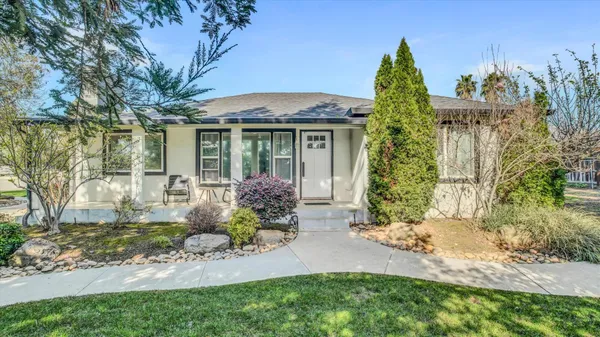 front view of a house with a yard