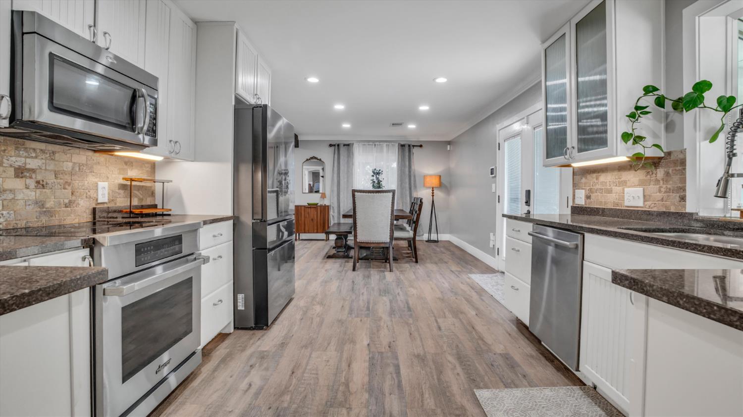 2331 East Woodson Road Acampo, CA 95220 - Photo 12 of 59 a kitchen with a sink appliances and cabinets