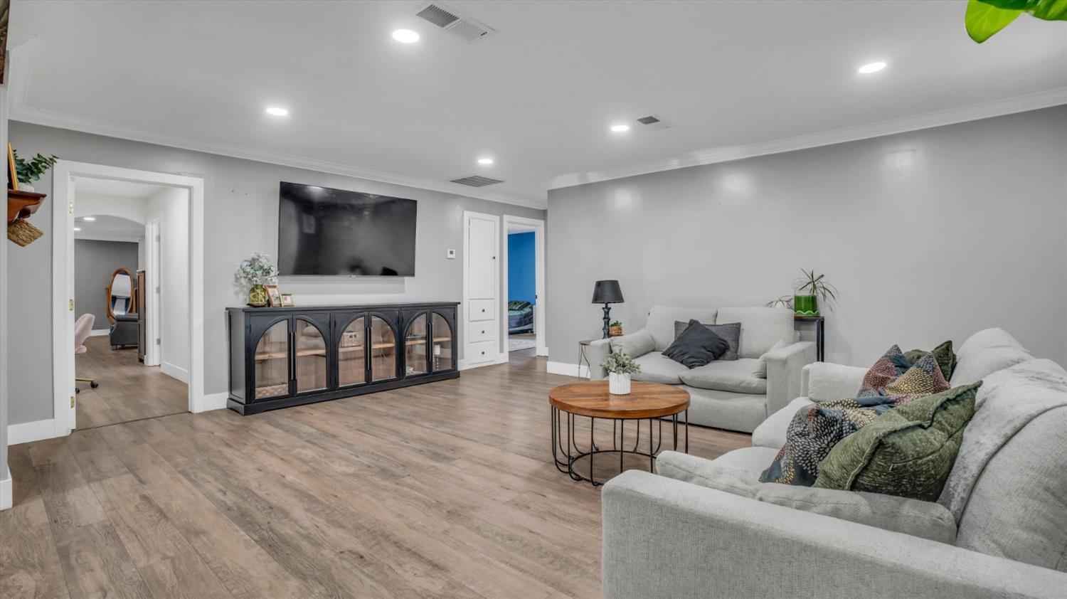 2331 East Woodson Road Acampo, CA 95220 - Photo 15 of 59 a living room with furniture and a flat screen tv