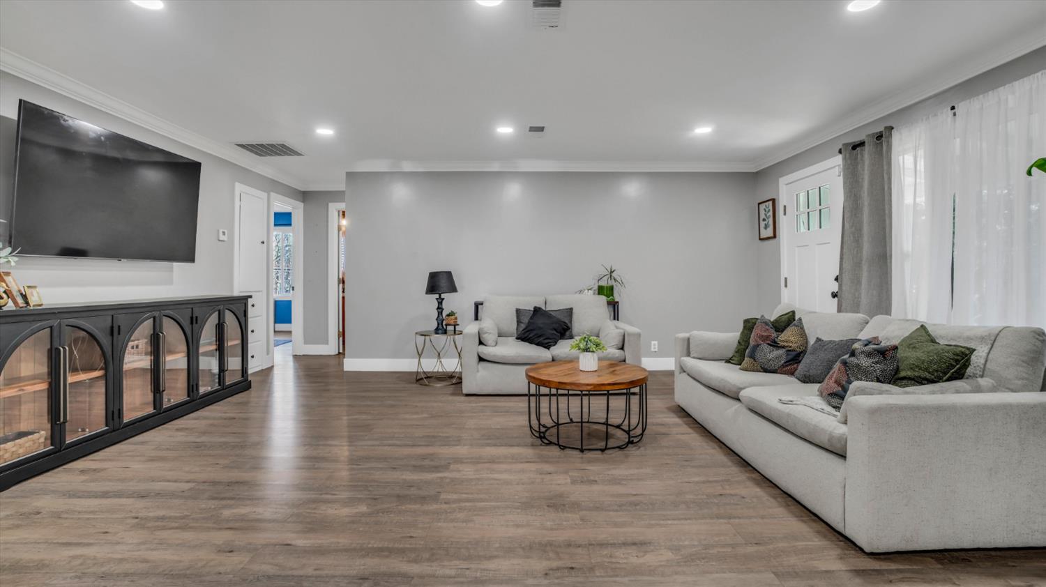 2331 East Woodson Road Acampo, CA 95220 - Photo 16 of 59 a living room with furniture and a flat screen tv